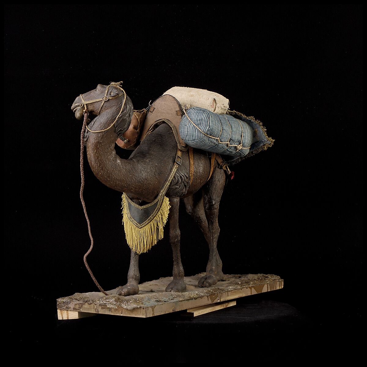 Camel, Polychromed wooden body covered with stucco; wooden saddle and leather girth straps; burlap cushion and leather saddlebags, Italian, Naples