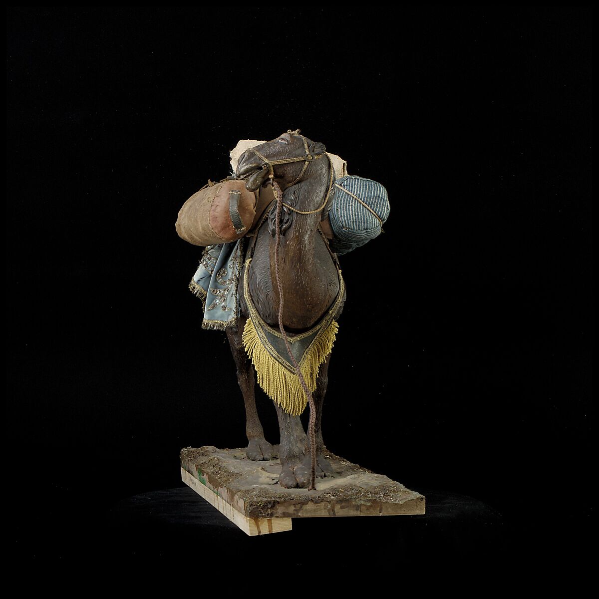 Camel, Polychromed wooden body covered with stucco; wooden saddle and leather girth straps; burlap cushion and leather saddlebags, Italian, Naples