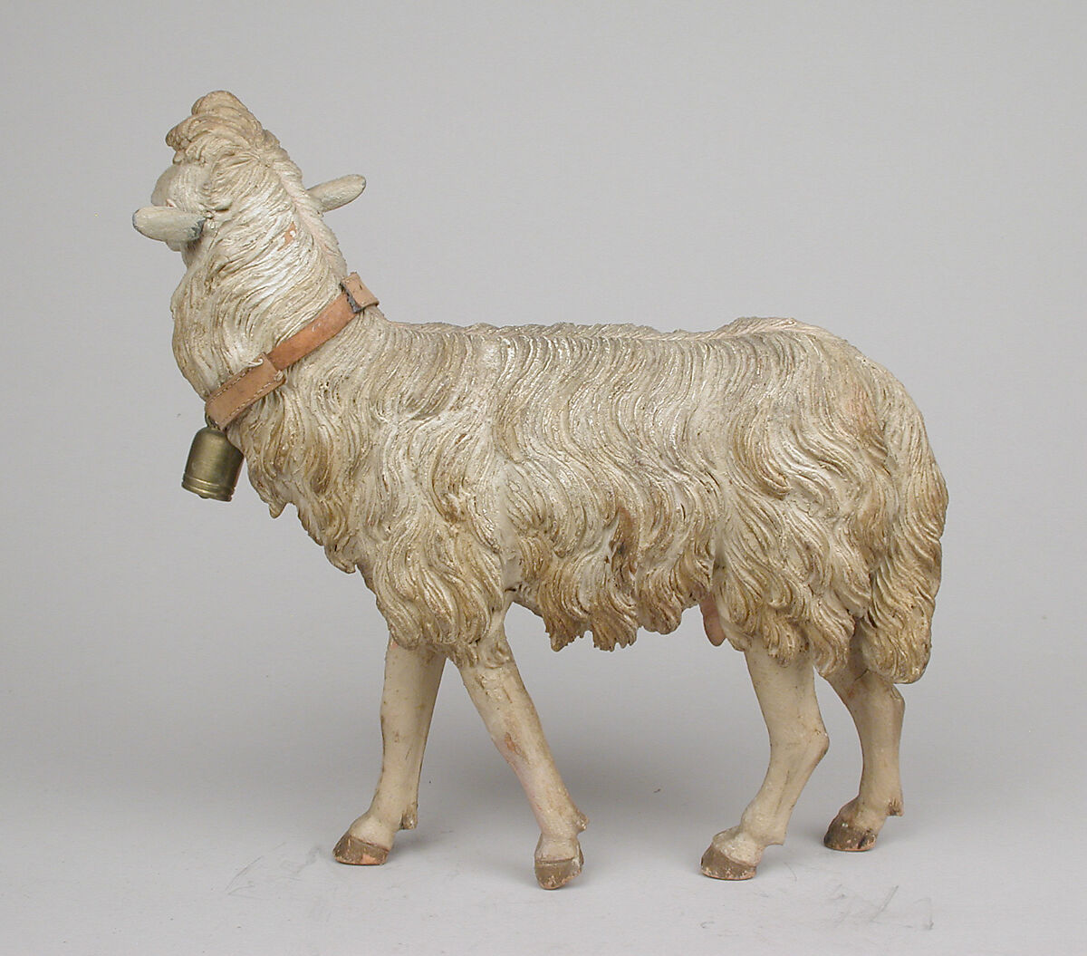 Standing sheep, Polychromed terracotta body, wooden legs, metal ears, Italian, Naples