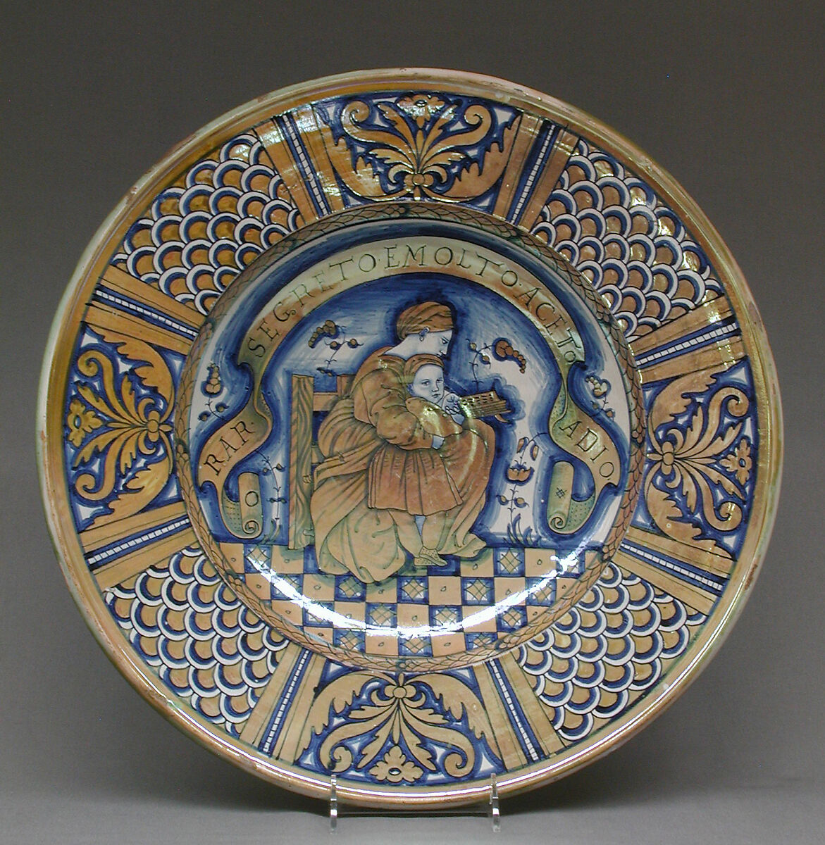 Plate with seated woman reading to a child, After a print by Marco Dente (Italian, Ravenna, active by 1515–died 1527 Rome), Maiolica (tin-glazed earthenware), lustered, Italian, Deruta 