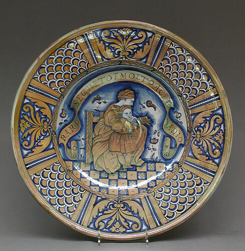 Plate with seated woman reading to a child
