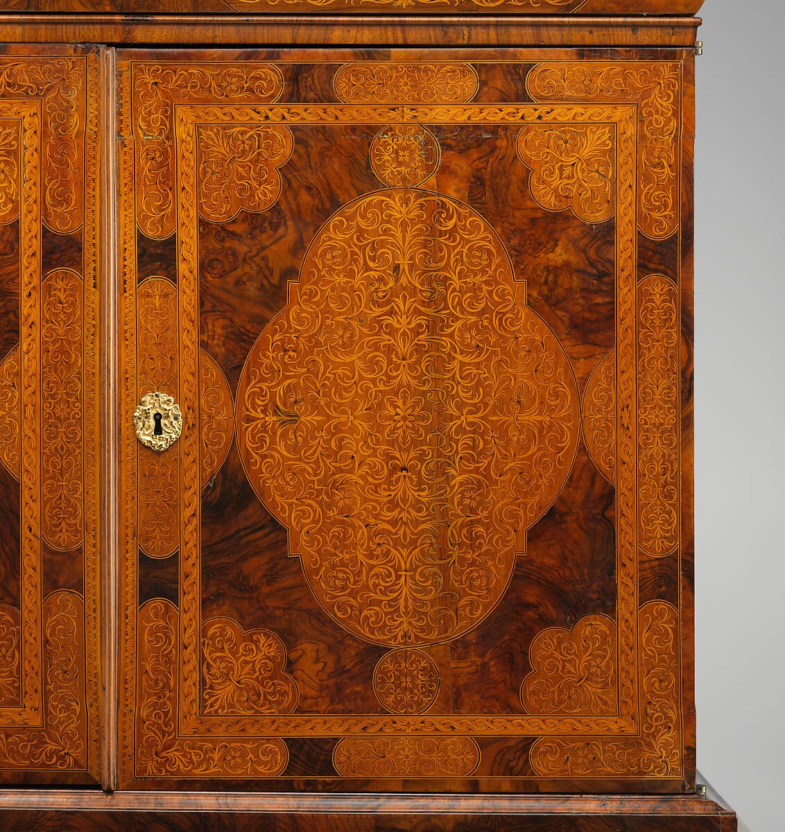 Cabinet on stand, Pine veneered with marquetry of walnut, burl walnut, holly; oak drawers; walnut legs; brass hardware, some of it replaced, British