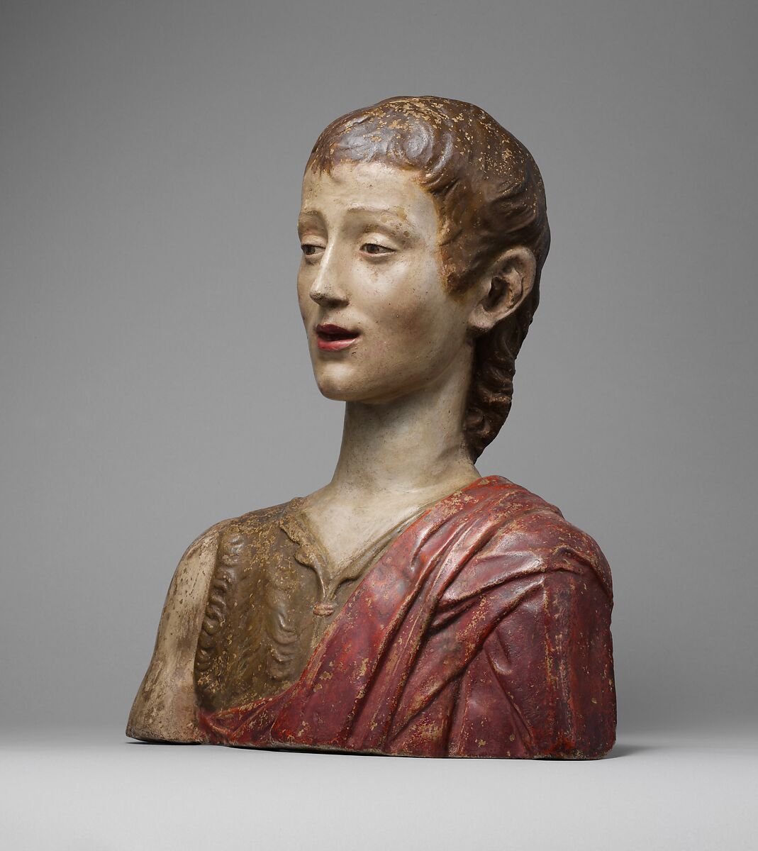 Saint John the Baptist, Follower of Mino da Fiesole (Mino di Giovanni) (Italian, Papiano or Montemignaio 1429–1484 Florence), Bust: stucco, polychromed; base: gilt wood, Italian, Florence