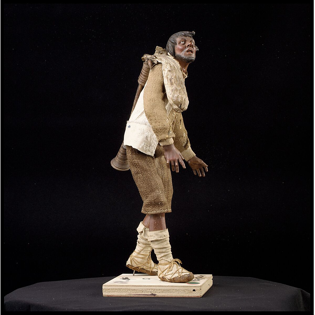 Man carrying bagpipes, Polychromed terracotta and wood; cloth, straw and leather, Italian, Naples