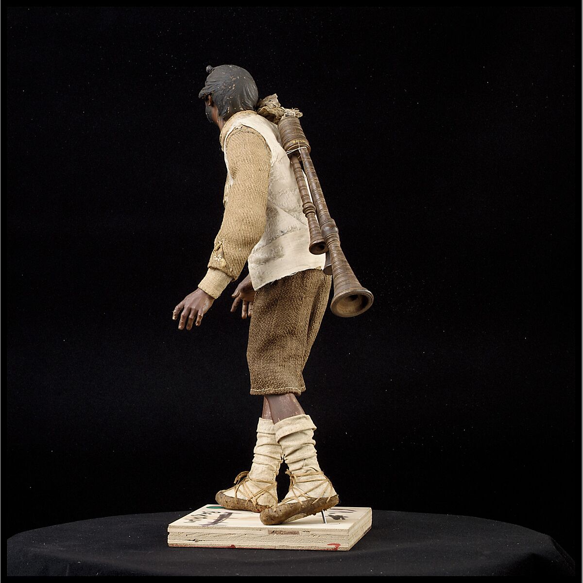 Man carrying bagpipes, Polychromed terracotta and wood; cloth, straw and leather, Italian, Naples