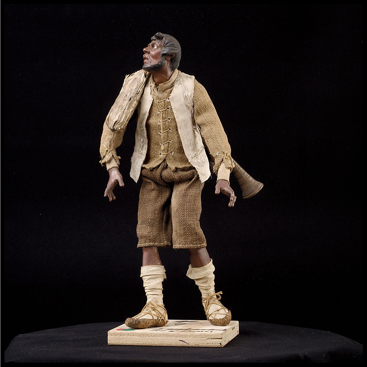 Man carrying bagpipes, Polychromed terracotta and wood; cloth, straw and leather, Italian, Naples