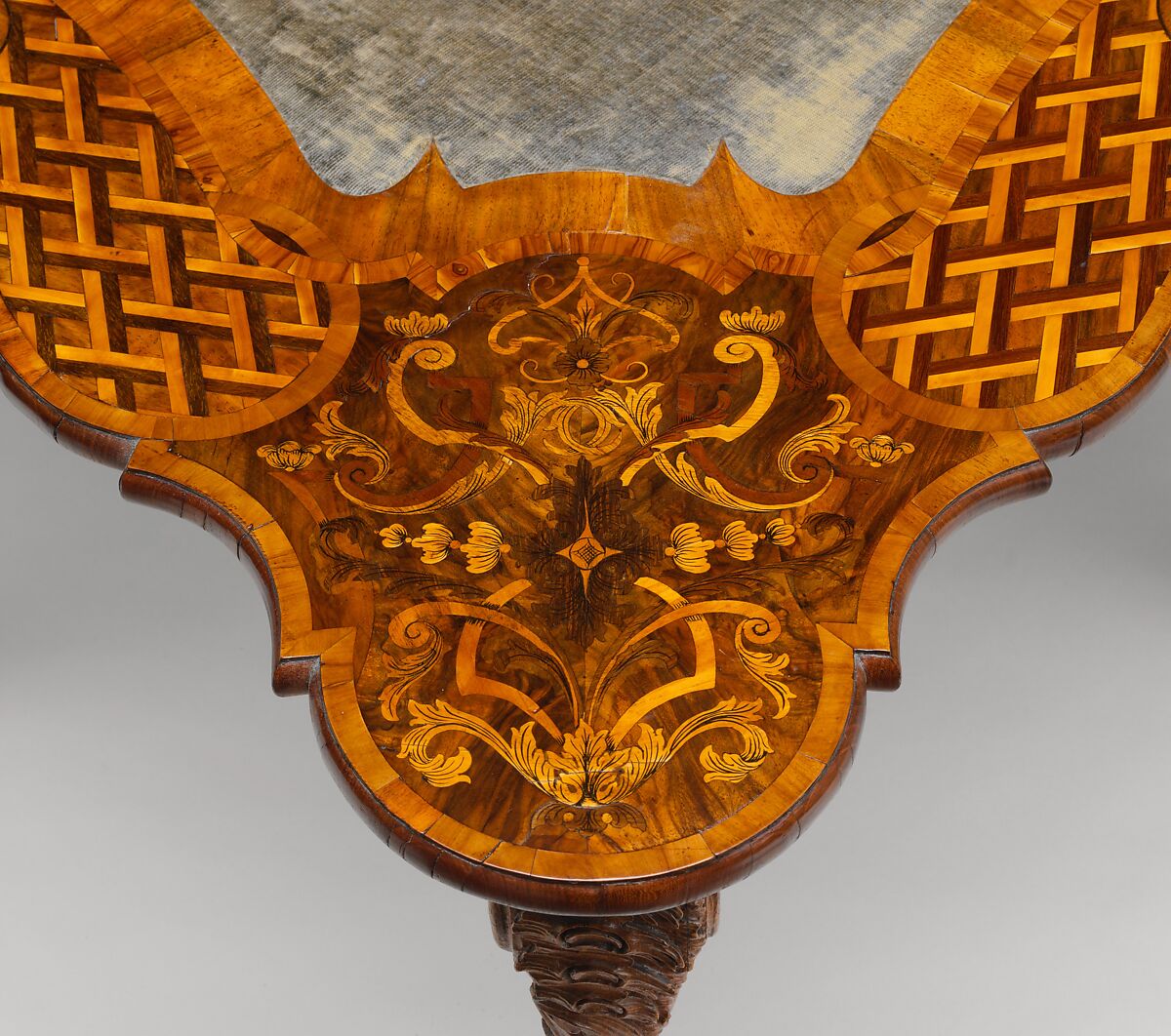 Card table, Carved walnut frame; pine top with marquetry of walnut, figured walnut, boxwood, alder burl, birch, olive wood, plum, padauk wood, yew, green-stained poplar, and other marquetry woods; lined with modern velvet; iron fittings, German, Bamberg