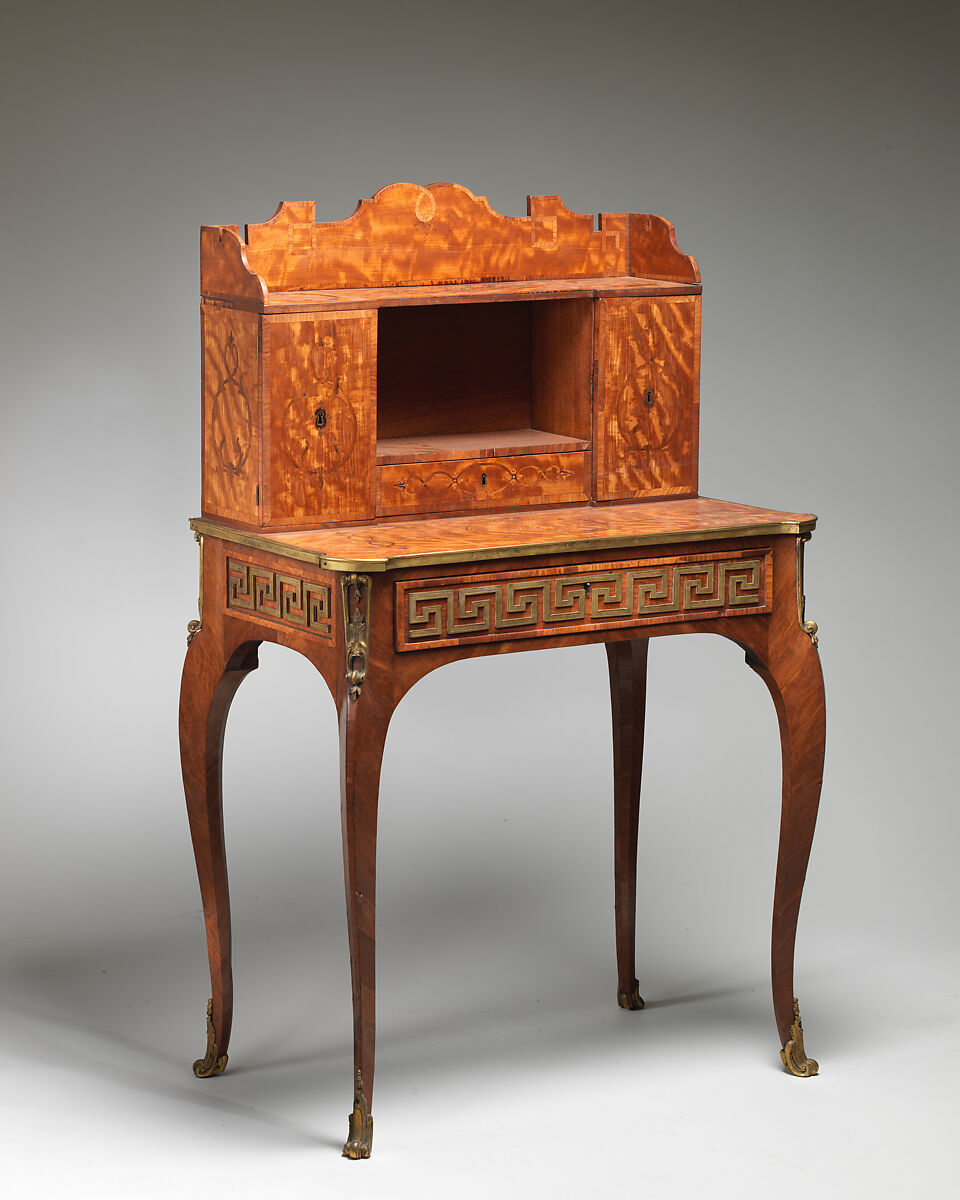 Small desk, Satinwood, purpleheart, padouk and other marquetry woods on oak substrate; mahogany interior; brass mounts; leather-lined writing surface, British 