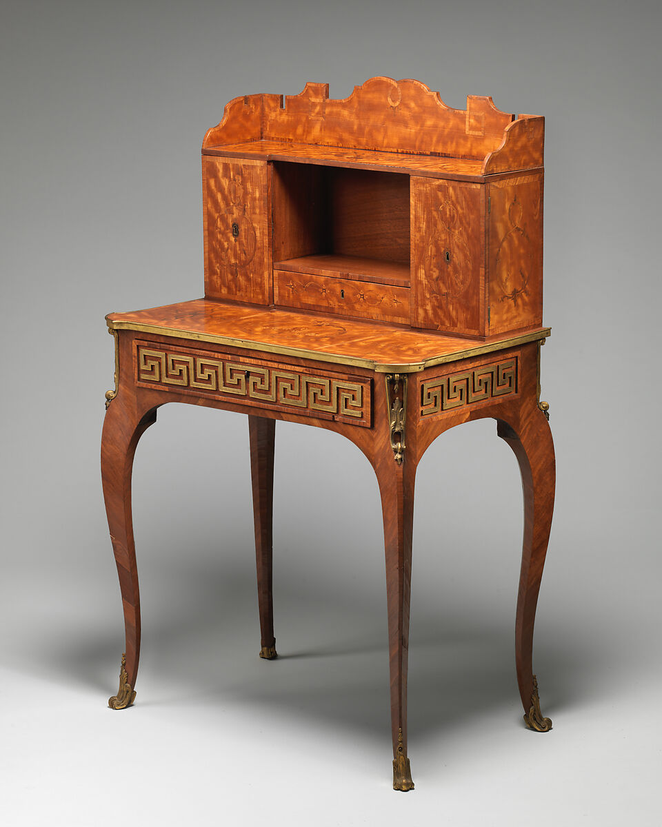 Small desk, Satinwood, purpleheart, padouk and other marquetry woods on oak substrate; mahogany interior; brass mounts; leather-lined writing surface, British