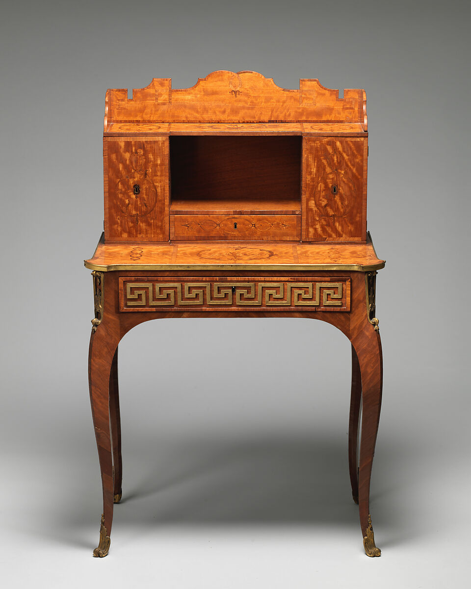 Small desk, Satinwood, purpleheart, padouk and other marquetry woods on oak substrate; mahogany interior; brass mounts; leather-lined writing surface, British