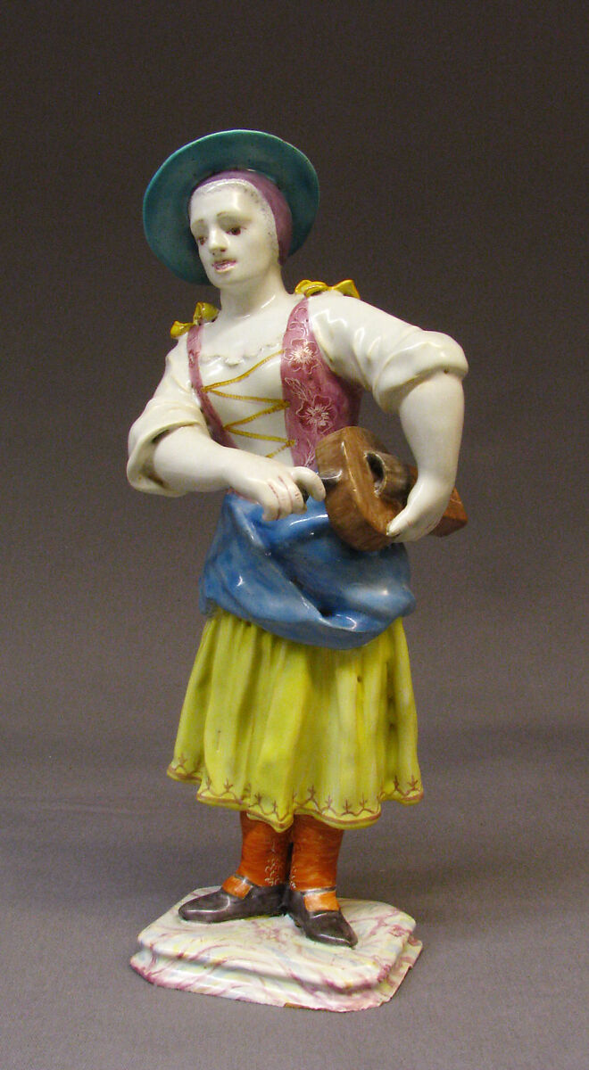 Girl cranking a hurdy-gurdy, Johannes Zeschinger (born 1723, active 1748, 1753), Tin-glazed earthenware, German, Höchst 