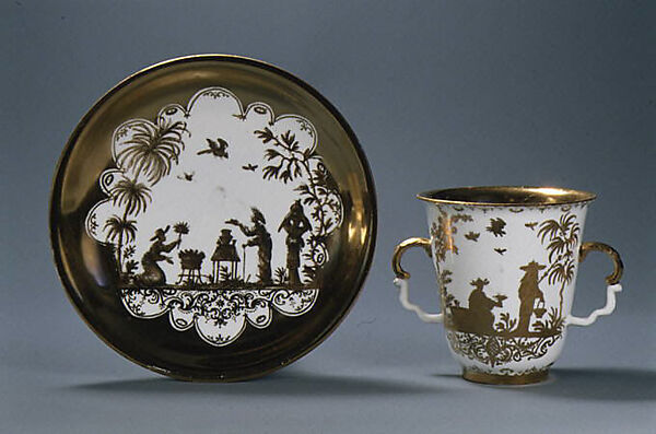 Two-handled beaker and saucer