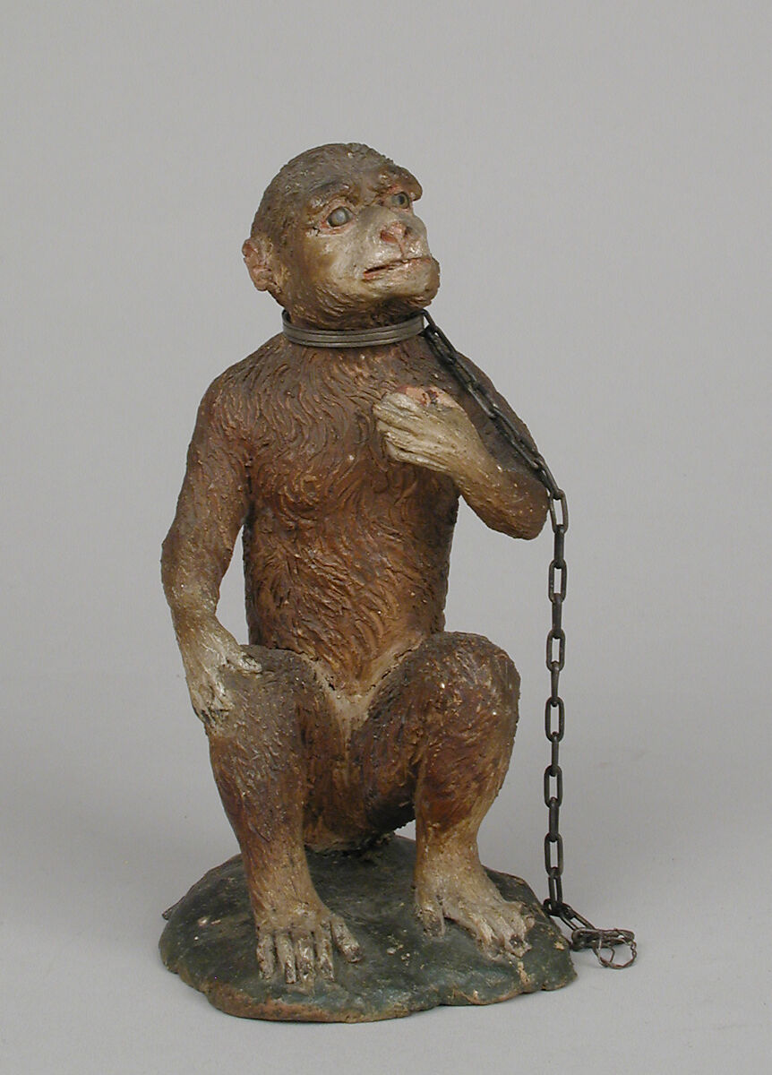 Seated monkey, Polychromed terracotta body; silver collar and chain, Italian, Naples