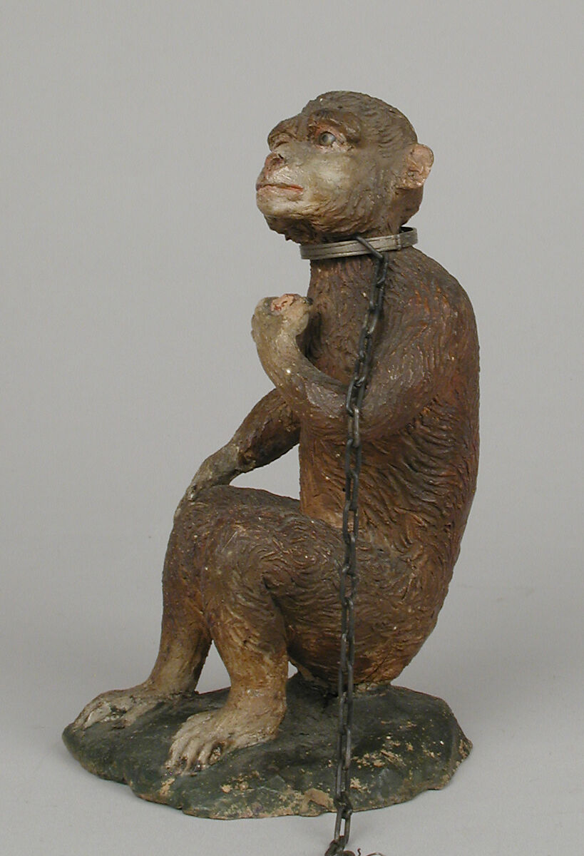 Seated monkey, Polychromed terracotta body; silver collar and chain, Italian, Naples