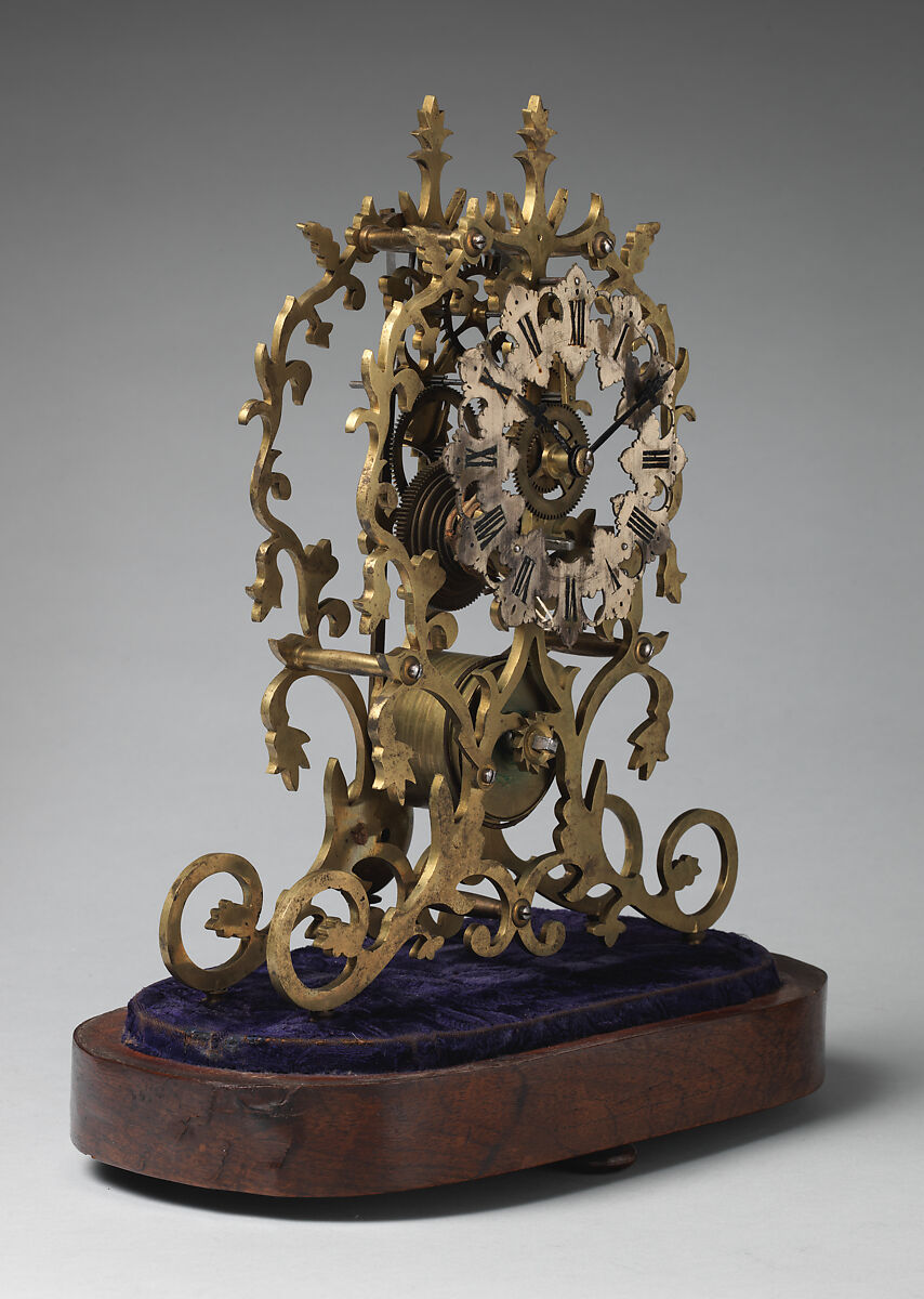 Skeleton clock and key, Brass, partly silvered and painted, velvet, rosewood veneer, glass, British