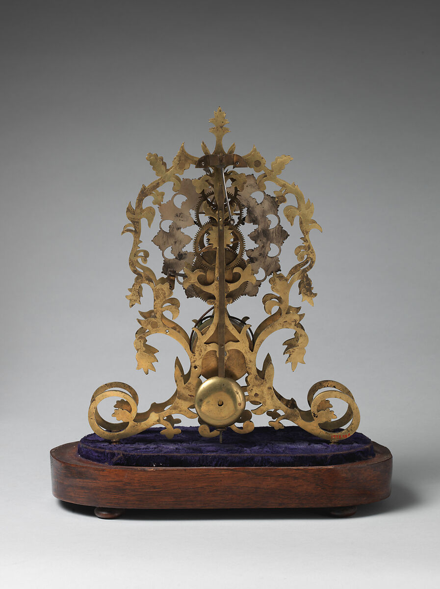 Skeleton clock and key, Brass, partly silvered and painted, velvet, rosewood veneer, glass, British