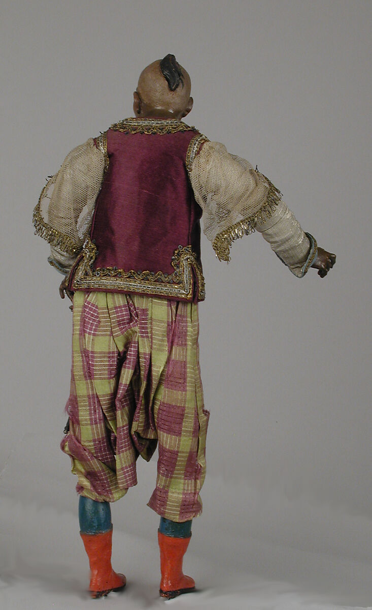 King's attendant, Polychromed terracotta head; wooden limbs; body of wire wrapped in tow; silk garments with silver and gold thread and buttons; gilt-metal sword, Italian, Naples