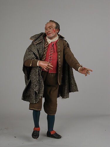 Man with cape and leather pouch