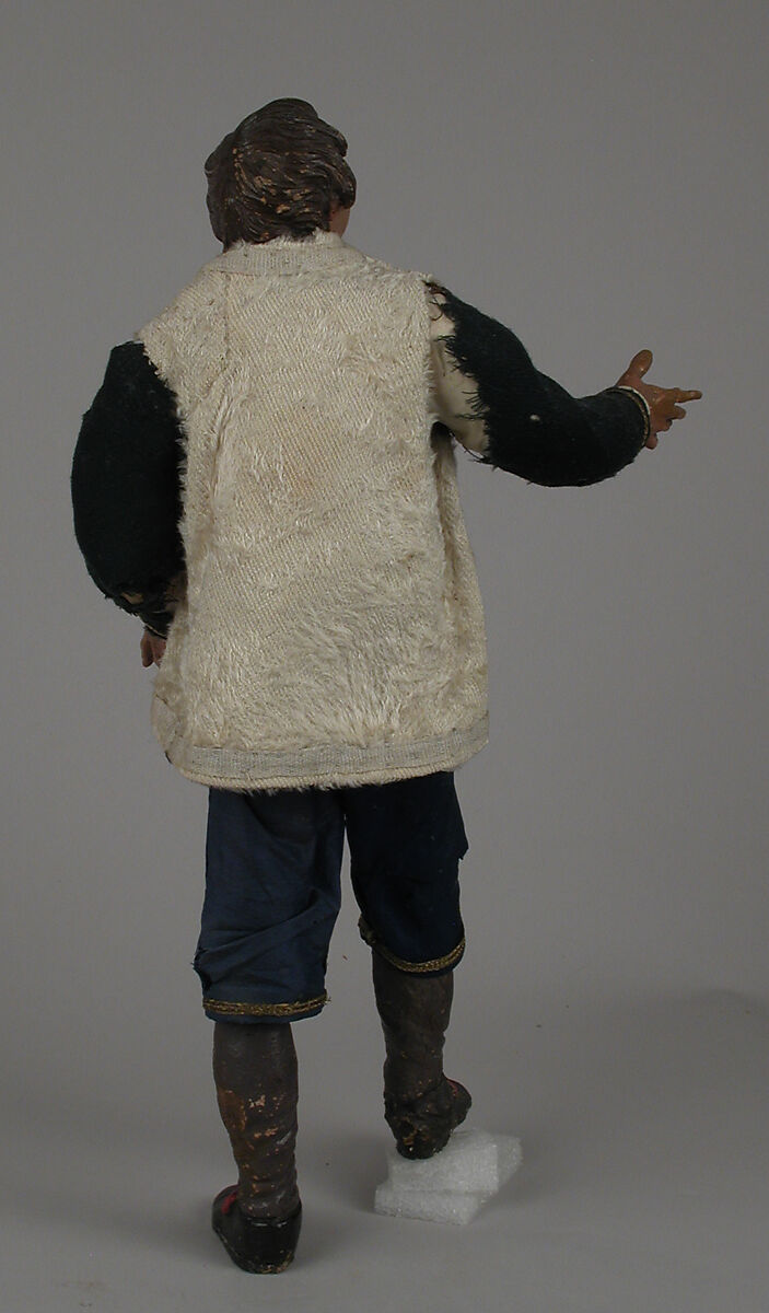 Young man in fur jacket, Polychromed terracotta head; wooden limbs; body of wire wrapped in tow; silk, wool and fur-like garments; leather pouch, Italian, Naples