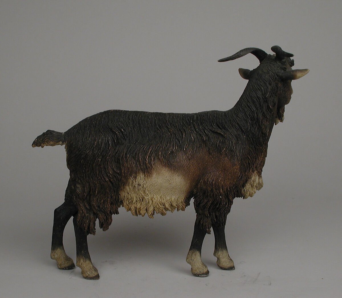 Standing female goat, Polychromed terracotta body with wooden ears and horns; lead eyes, Italian, Naples