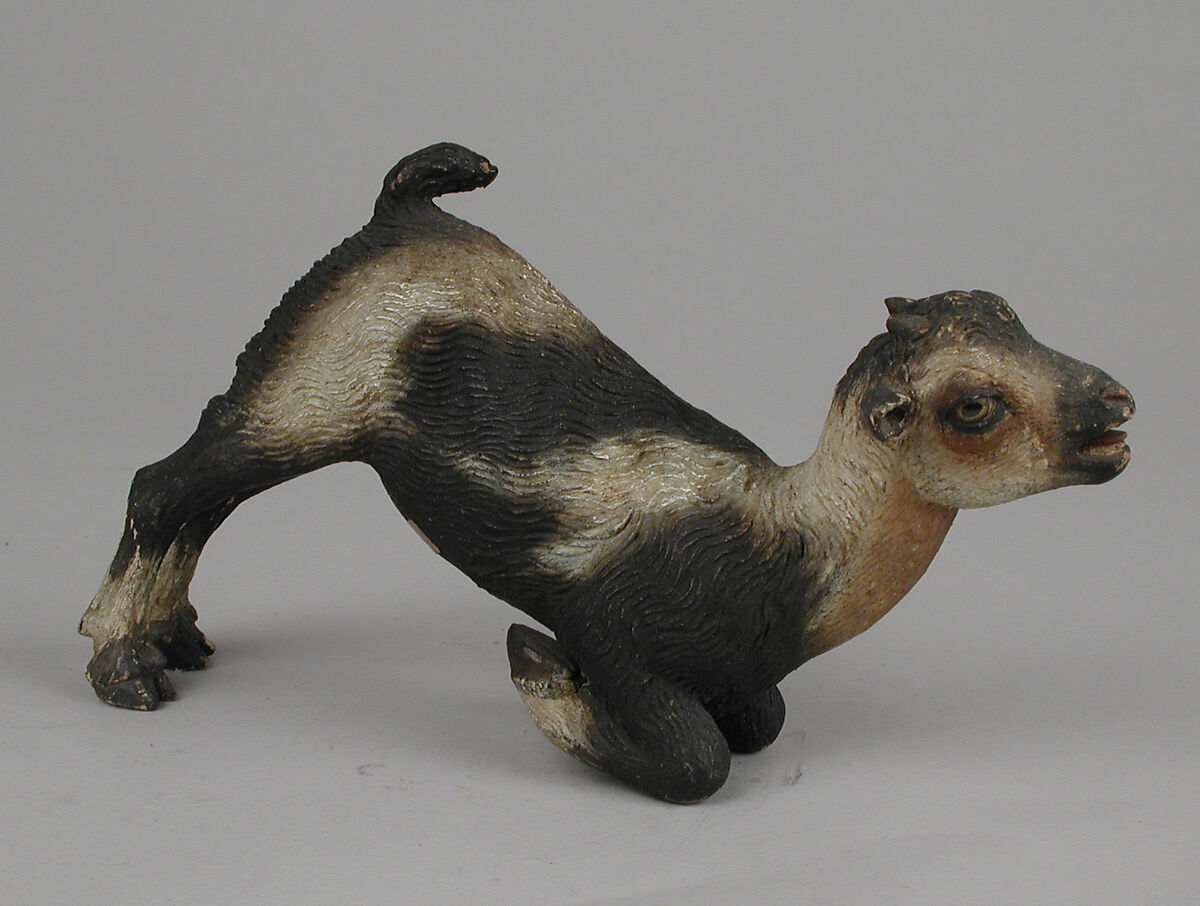 Nursing kid, Polychromed terracotta body with wooden ears and rear legs, Italian, Naples