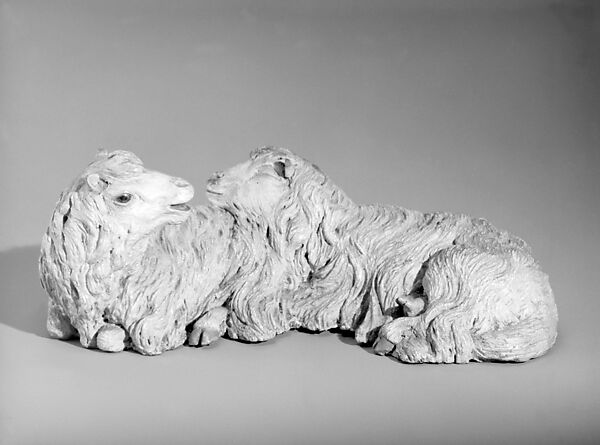 Pair of reclining sheep, Polychromed terracotta body with glass eyes, Italian, Naples