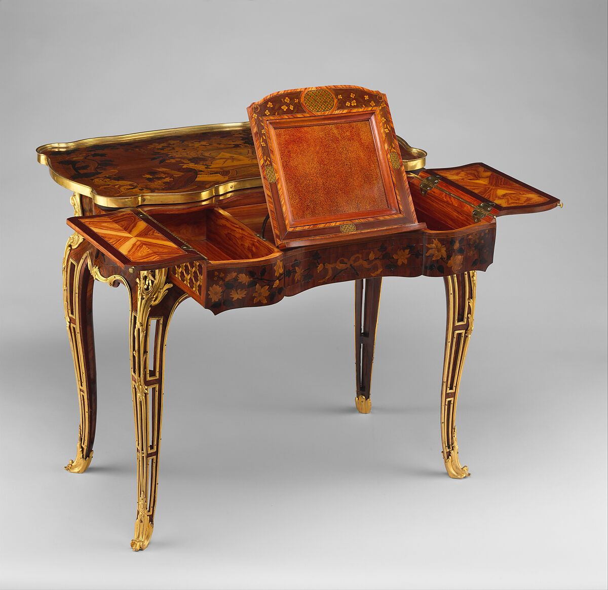 Mechanical table, Jean-François Oeben (French, born Germany, Heisenberg 1721–1763 Paris), Oak veneered with mahogany, kingwood, and tulipwood, with marquetry of mahogany, rosewood, holly, and various other woods; gilt-bronze mounts; imitation Japanese lacquer; replaced silk, French