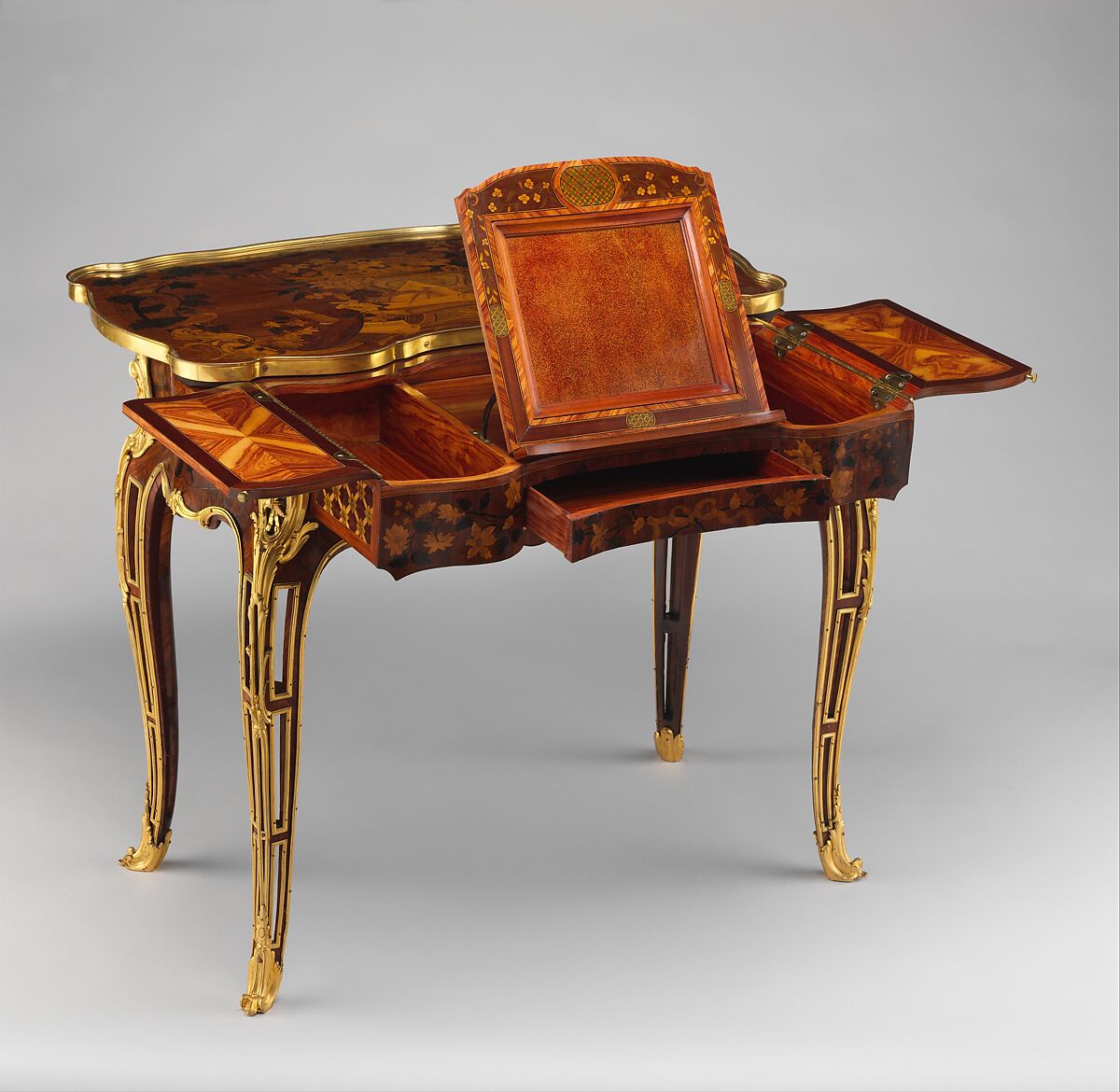 Mechanical table, Jean-François Oeben (French, born Germany, Heisenberg 1721–1763 Paris), Oak veneered with mahogany, kingwood, and tulipwood, with marquetry of mahogany, rosewood, holly, and various other woods; gilt-bronze mounts; imitation Japanese lacquer; replaced silk, French