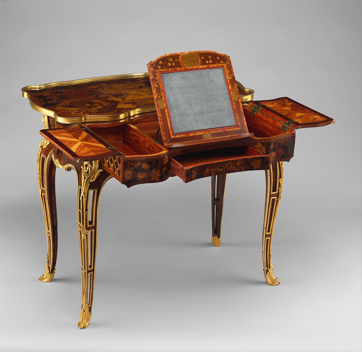 Mechanical table, Jean-François Oeben (French, born Germany, Heisenberg 1721–1763 Paris), Oak veneered with mahogany, kingwood, and tulipwood, with marquetry of mahogany, rosewood, holly, and various other woods; gilt-bronze mounts; imitation Japanese lacquer; replaced silk, French