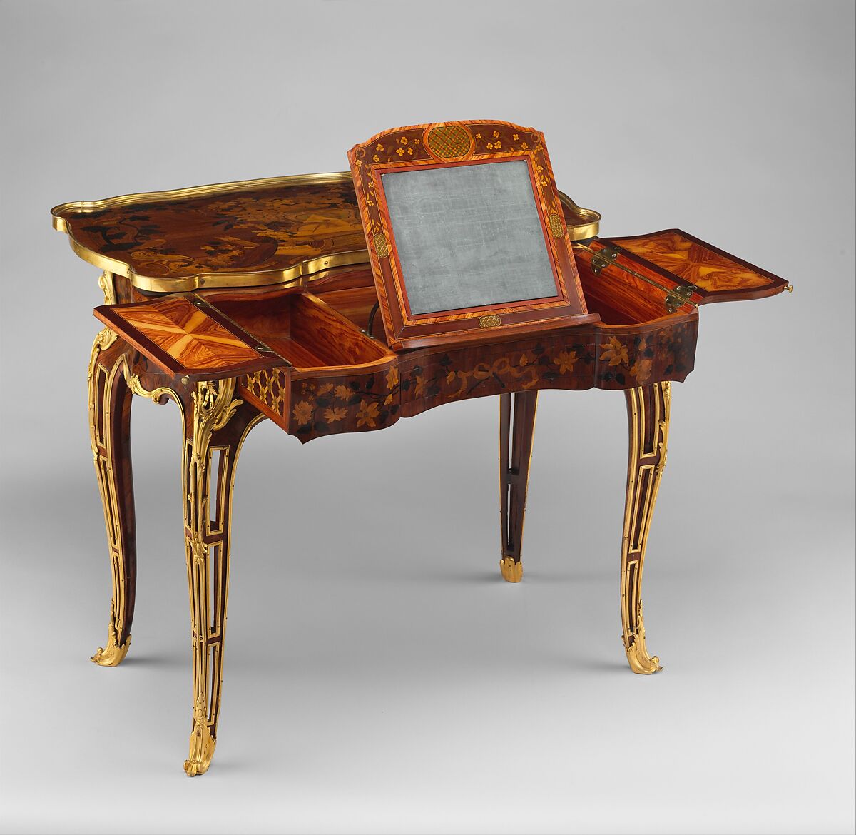 Mechanical table, Jean-François Oeben (French, born Germany, Heisenberg 1721–1763 Paris), Oak veneered with mahogany, kingwood, and tulipwood, with marquetry of mahogany, rosewood, holly, and various other woods; gilt-bronze mounts; imitation Japanese lacquer; replaced silk, French