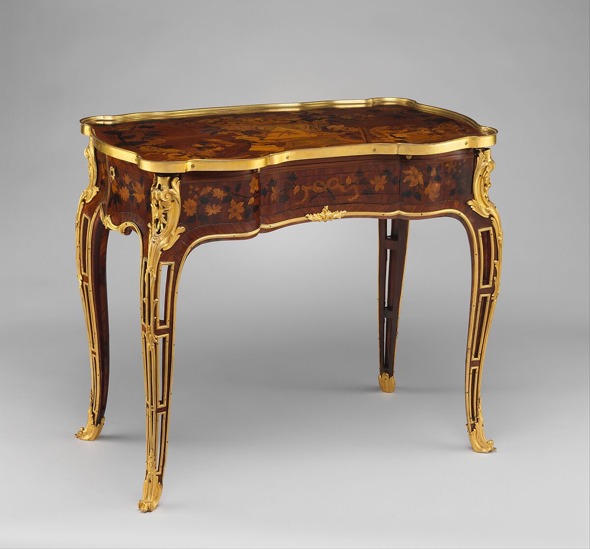 Mechanical table, Jean-François Oeben  French, born Germany, Oak veneered with mahogany, kingwood, and tulipwood, with marquetry of mahogany, rosewood, holly, and various other woods; gilt-bronze mounts; imitation Japanese lacquer; replaced silk, French