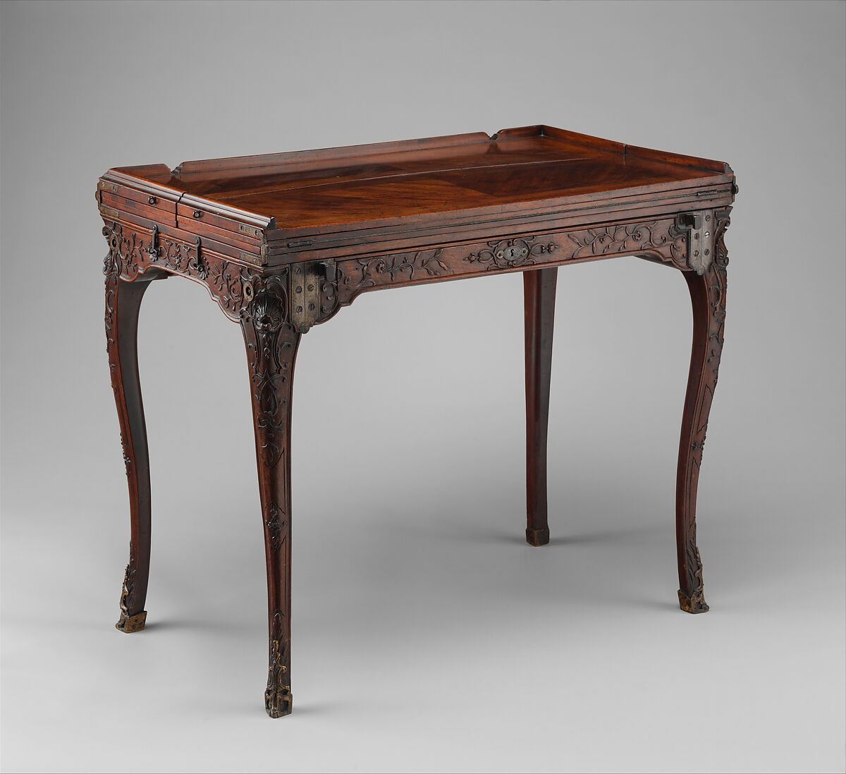Traveling table (table de voyage or table pliante), Carved walnut; gilt-bronze mounts; steel hinges; linings of felt and leather, French