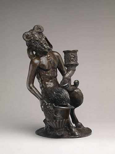 Seated satyr with an inkwell and a candlestick