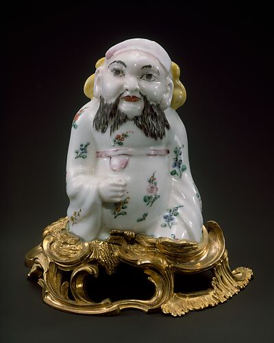 Figure of a seated Chinese man