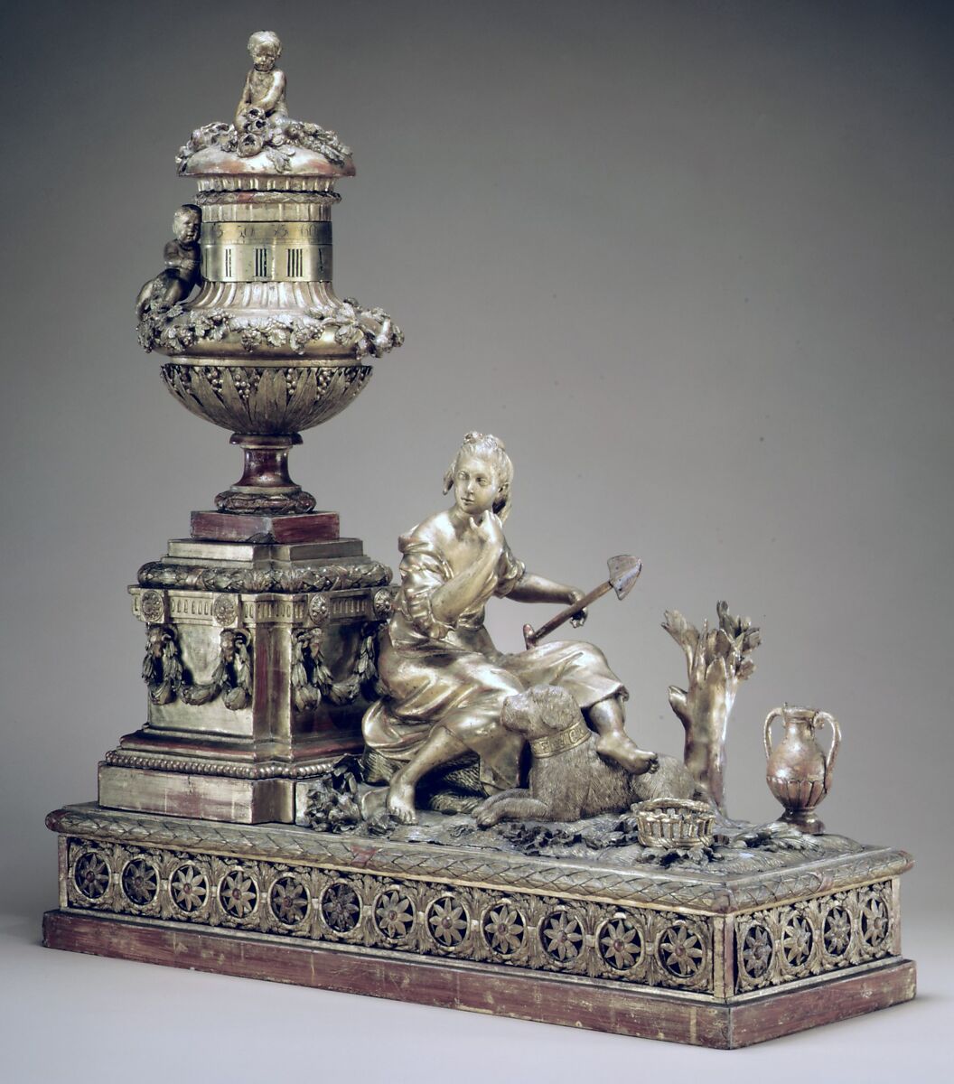 Mantel clock, Case: carved and gilded wood; Revolving rings for hours and minutes: gilded brass; Movement: brass and steel, probably Austrian 