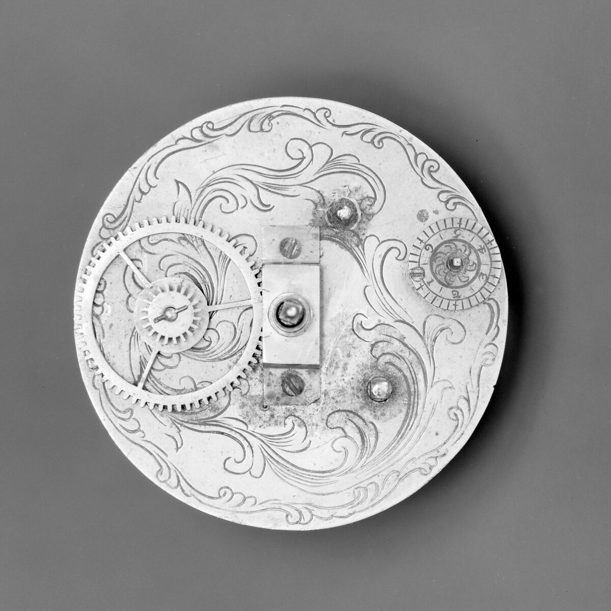 Mantel clock, Case: carved and gilded wood; Revolving rings for hours and minutes: gilded brass; Movement: brass and steel, probably Austrian