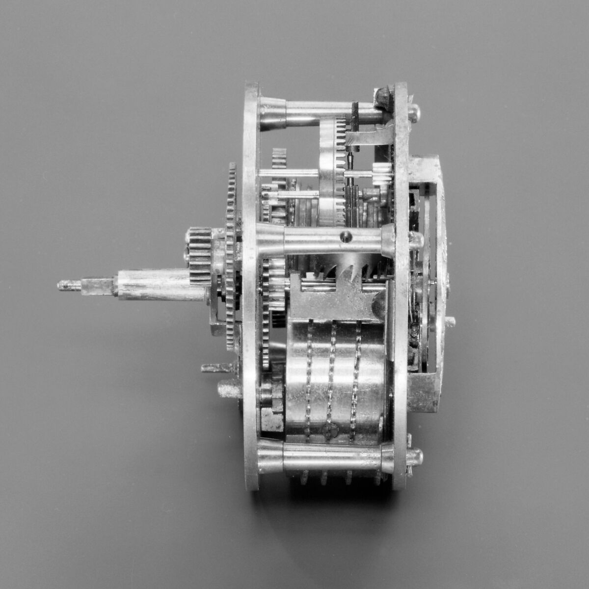 Mantel clock, Case: carved and gilded wood; Revolving rings for hours and minutes: gilded brass; Movement: brass and steel, probably Austrian