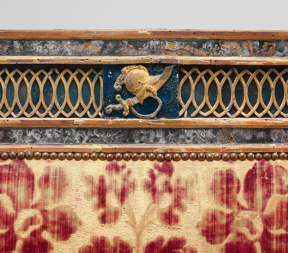 Triple-back settee (part of a set), Carved, gilded and painted walnut, reverse painted glass, cut and voided 17th-century crimson velvet, Italian, Sicily