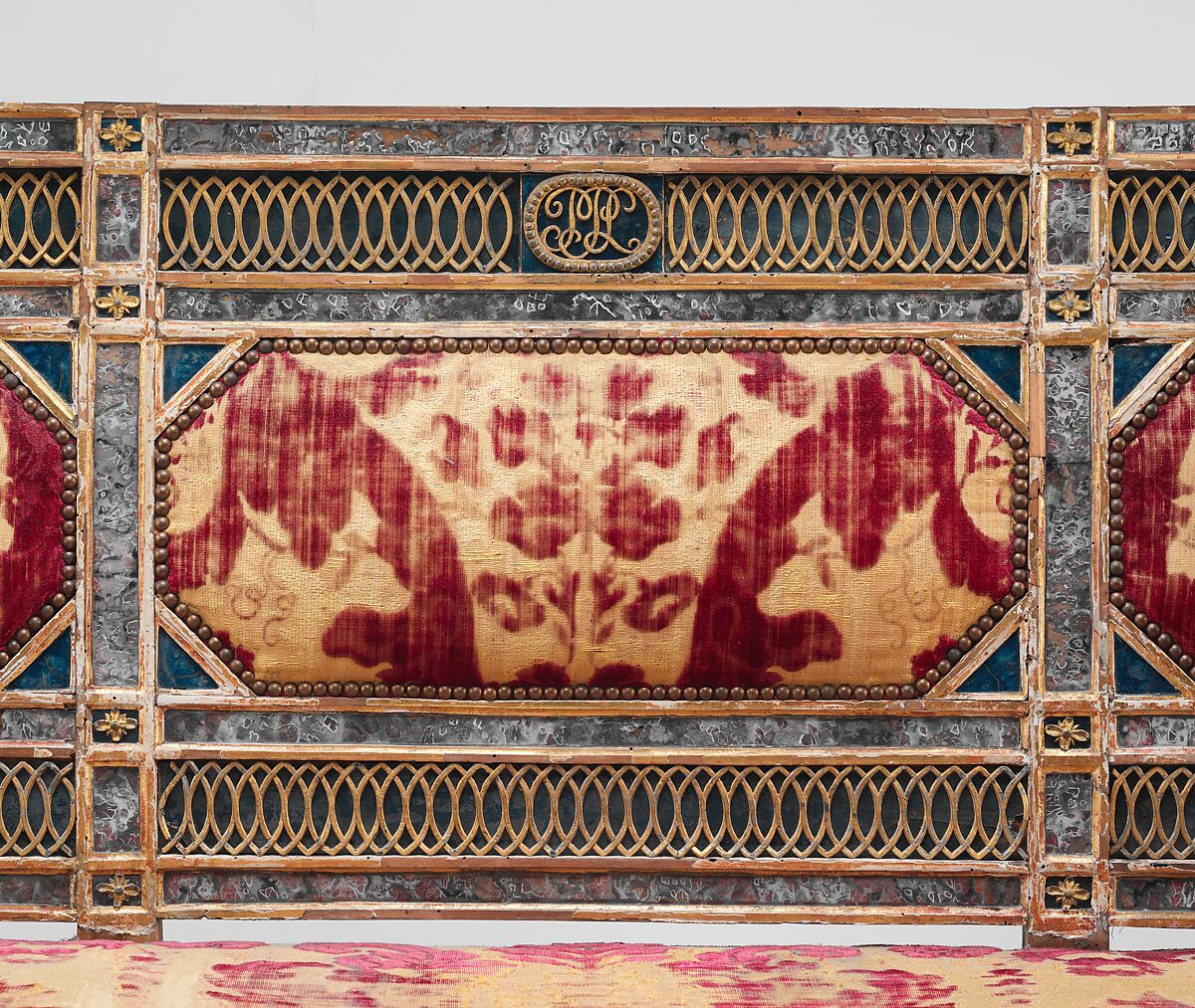Triple-back settee (part of a set), Carved, gilded and painted walnut, reverse painted glass, cut and voided 17th-century crimson velvet, Italian, Sicily