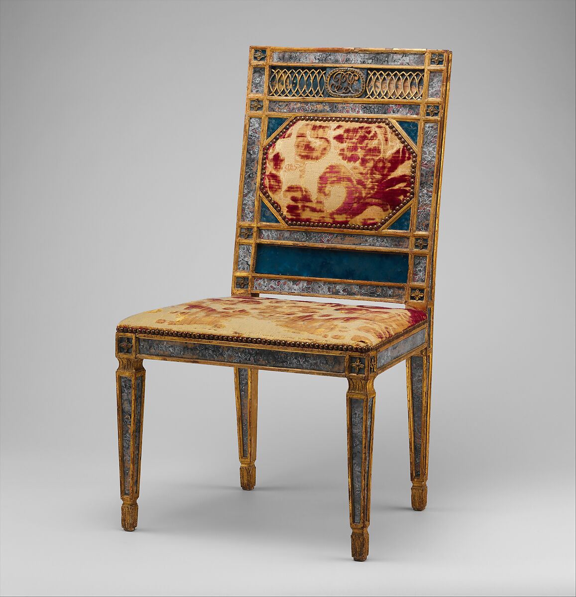 Side chair (part of a set), Carved, gilded and painted walnut, reverse-painted glass (verre églomisé), cut and voided 17th-century crimson silk velvet probably not original to the chair, Italian, Sicily 