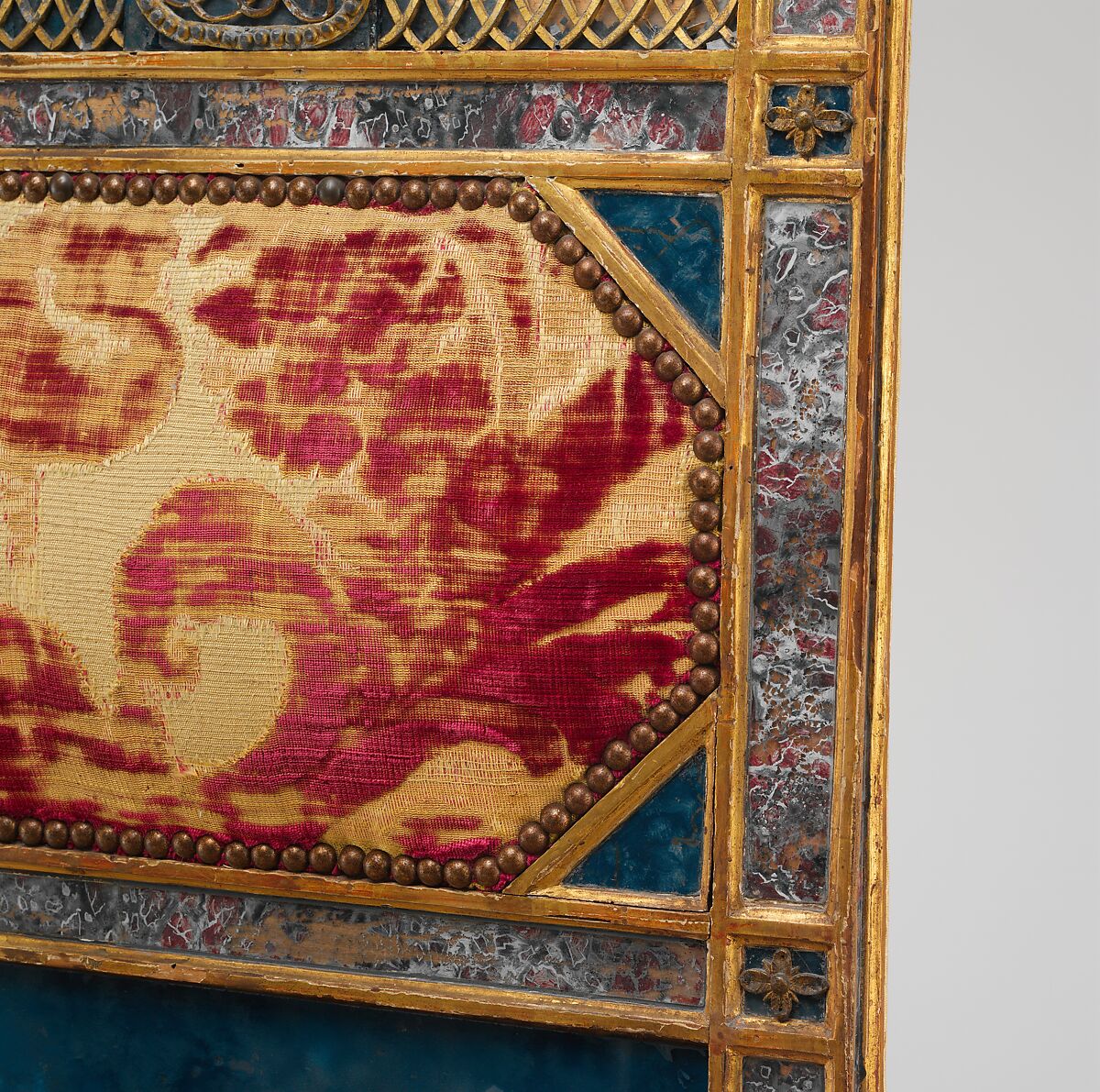 Side chair (part of a set), Carved, gilded and painted walnut, reverse-painted glass (verre églomisé), cut and voided 17th-century crimson silk velvet probably not original to the chair, Italian, Sicily