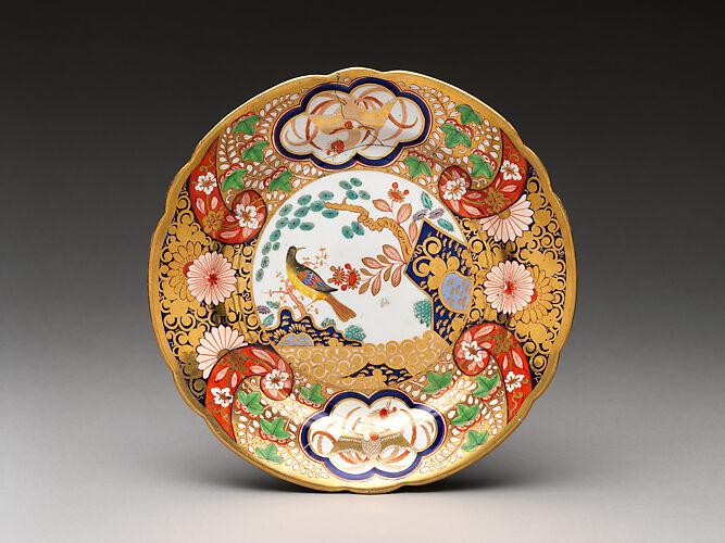 Plate with rocks, flowers, and birds