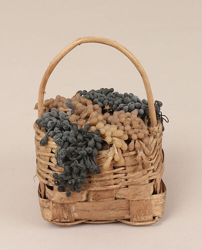 Basket of purple and yellow grapes