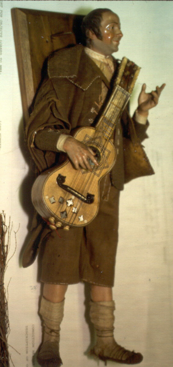 Guitarist, Polychromed terracotta head and wooden limbs; body of wire wrapped in tow; cotton and leather garments; guitar of wood inlaid with shell (?), Italian, Naples