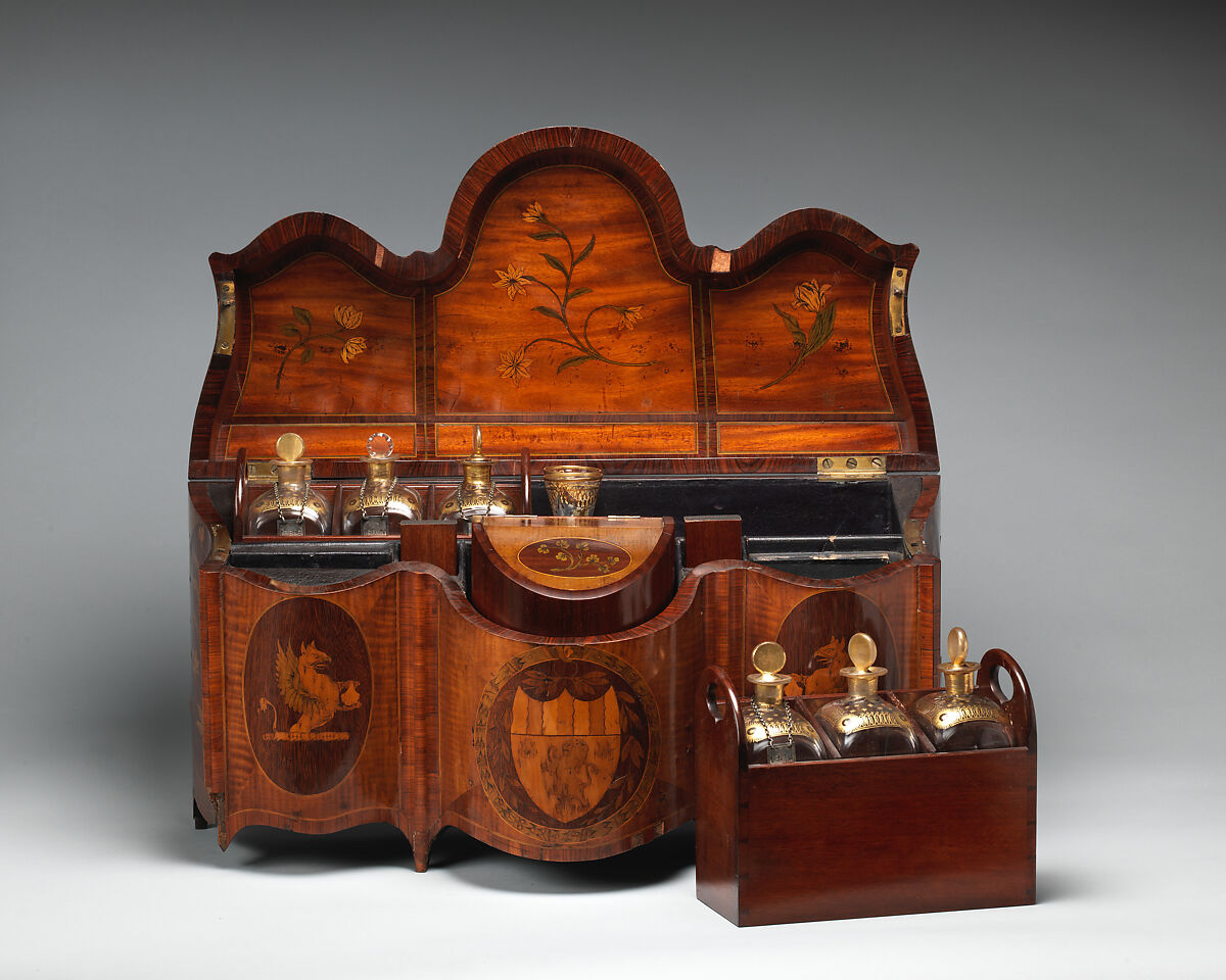 Spirit case with bottles and glasses, Satinwood veneer, inlaid with tulip and other woods; glass, British