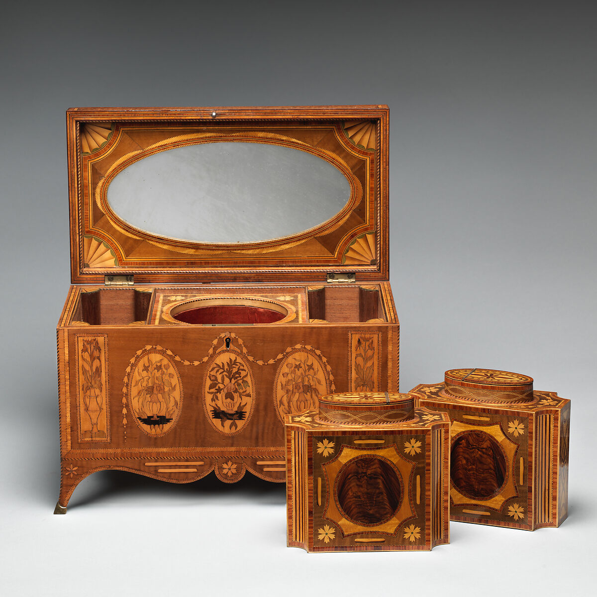 Tea chest with tea caddies, Cedar and oak veneered with maple, harewood, tulipwood, kingwood, satinwood, amaranth, holly, and stained holly; foil lining, British