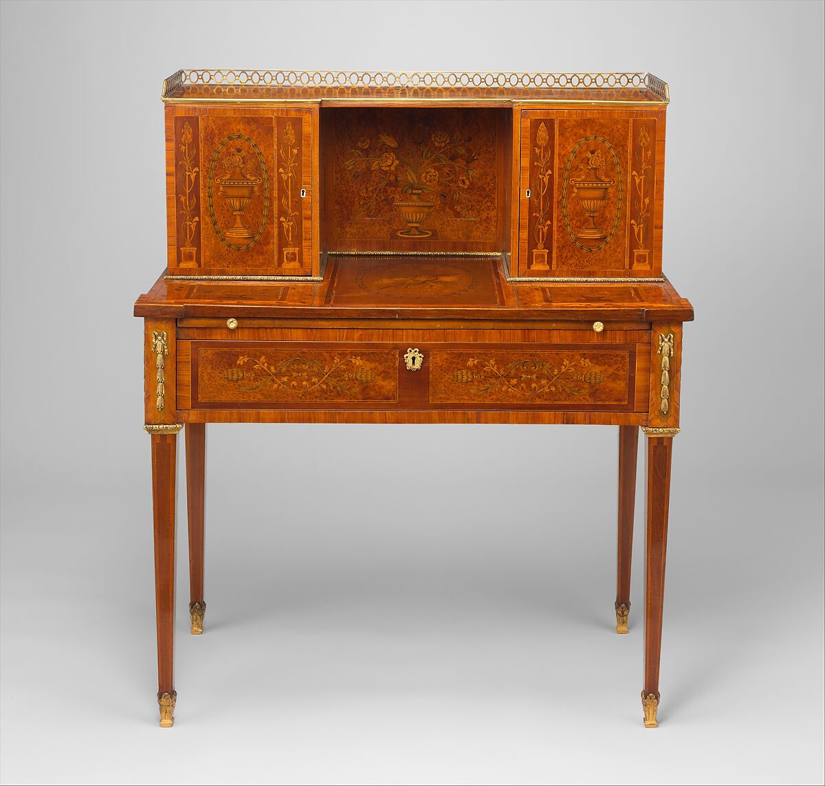 Desk (bonheur du jour), Wood, ivory, gilt bronze
Carcass woods:  mahogany and oak, with mahogany drawer linings
Veneer woods include satinwood, mahogany, yewwood,  tulipwood, rosewood, partridegewood (?), walnut, green-stained sycamore, and boxwood stringing, British 