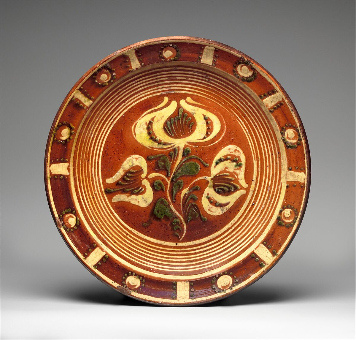 Redware Slip-decorated dish, Attributed to Dennis Family Potters, Red earthenware 