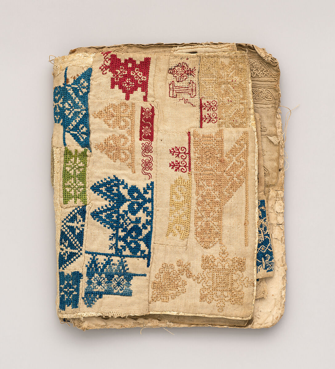 Booklet of embroidery and drawnwork, Linen, silk, leather, paper; techniques include cross stitch, reticello, drawnwork, satin stitch, knots, bullion stitch, probably Portuguese