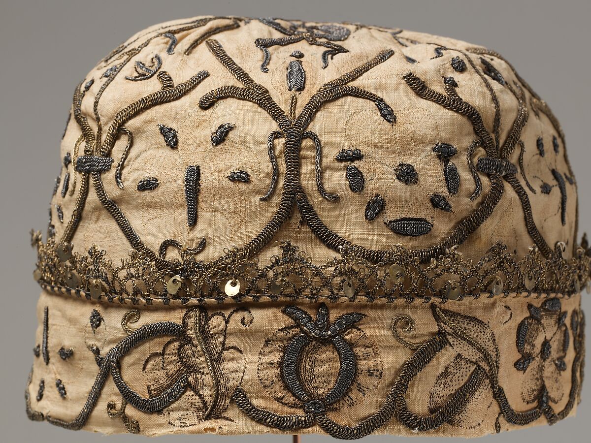 Night cap, Linen worked with silk and metal thread, spangles; speckling, running, outline, and plaited braid stitches; metal bobbin lace, British